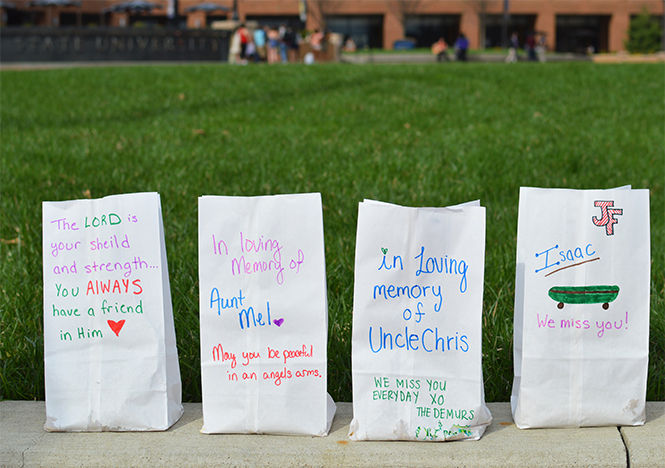  Luminaire memorials to individuals who committed suicide line the sidewalk of Risman Plaza during the Out of Darkness Campus Walk on April 18, 2015.