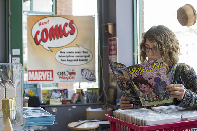 An+employee+at+Off+The+Wagon%2C+reads+a+comic+book.