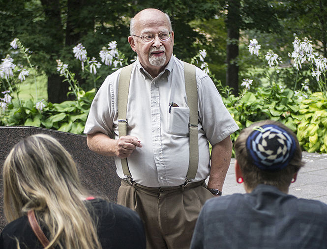 Jerry M. Lewis, Kent State professor emeritus of sociology, gives a tour of the May 4 walk on Sept. 15, 2014. Lewis was a professor on campus during the shooting on May 4, 1970.