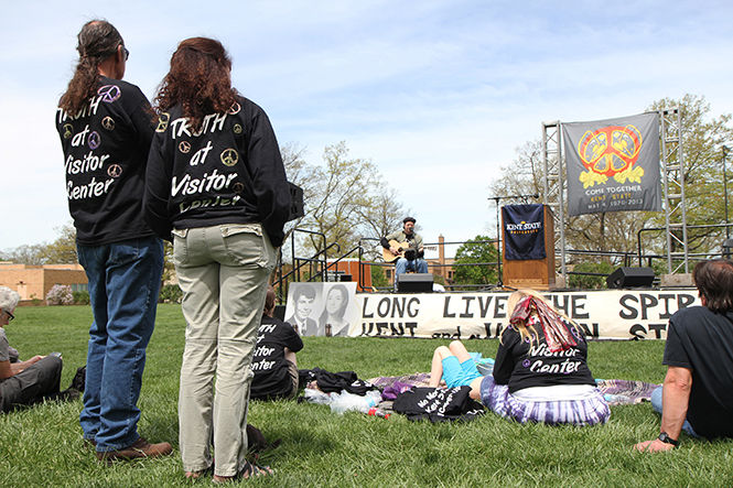 Musician Charlie Mosbrook performs in front of attendees of the annual May 4 commemoration of the Kent State shootings in 1970, Saturday, May 4, 2013 on Blanket Hill outside Taylor Hall.