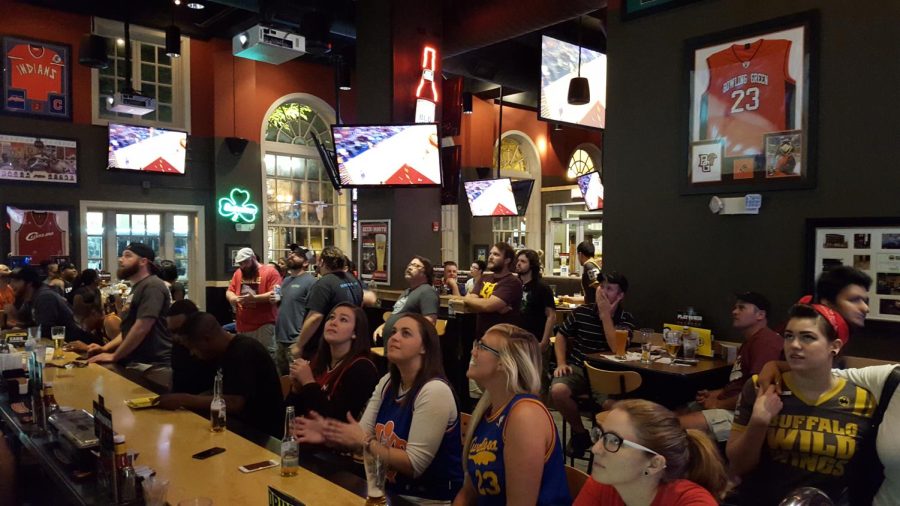 Cleveland Cavaliers fans watch Game 3 of the NBA Finals against the Golden State Warriors at Buffalo Wild Wings in downtown Kent on Tuesday, June 9, 2015. The Cavs beat the Warriors 96-91, bringing the series to 2-1 in favor of the Cavs.