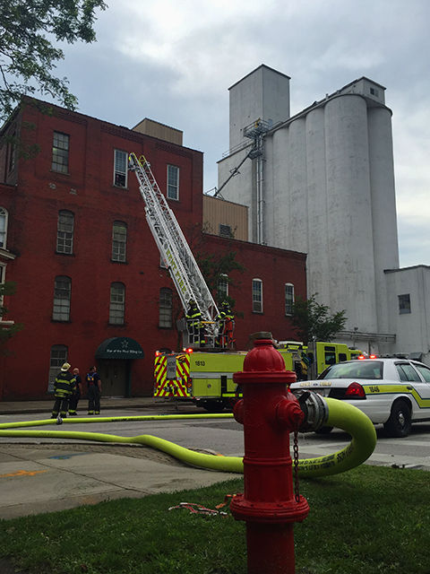 Members of the Kent Fire Department respond to a possible structure fire at the Star of the West Milling Co. on North Water Street on Monday, July 13 2015. A worker from the mill said the sprinkler system was activated on the fourth floor around 5:15 p.m. No injuries were reported.