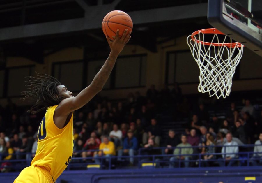 Sophomore forward Marquiez Lawrence goes for the net during a game against Toledo in the M.A.C. Center on Wednesday, Jan. 21, 2015. The Flashes beat the Rockets, 67-60.