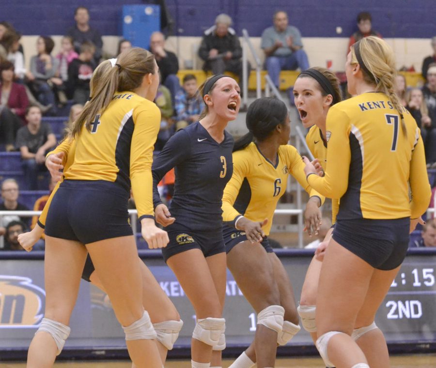 Kent States volleyball team cheers each other on during the game against MAC opponent Ohio University on Thursday, Oct. 30, 2014.
