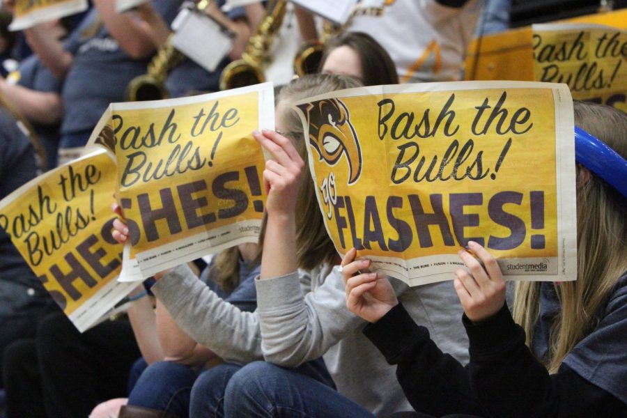 Fans+hold+up+a+Kent+Stater+issue+which+reads%2C+Bash+the+Bulls%21+Go+Flashes%21+at+the+Kent+State+mens+basketball+game+on+Saturday%2C+Feb.+28%2C+2015.