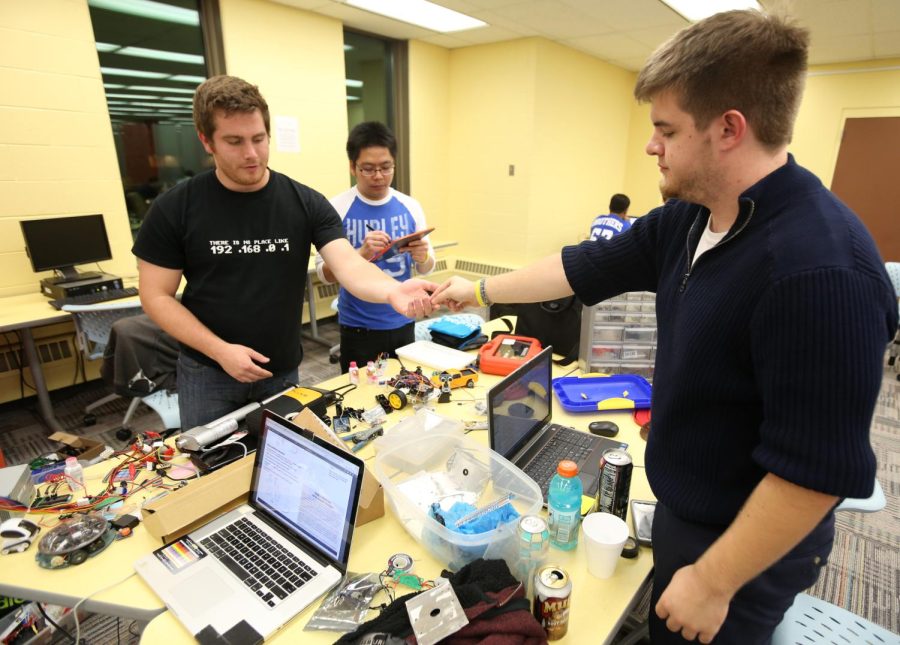 The Kent State Robotics Team works on its robot for Kent Hack Enough, a two-day long event hosted by HacKSU on the fourth floor in the University Library on Oct. 24, 2014.