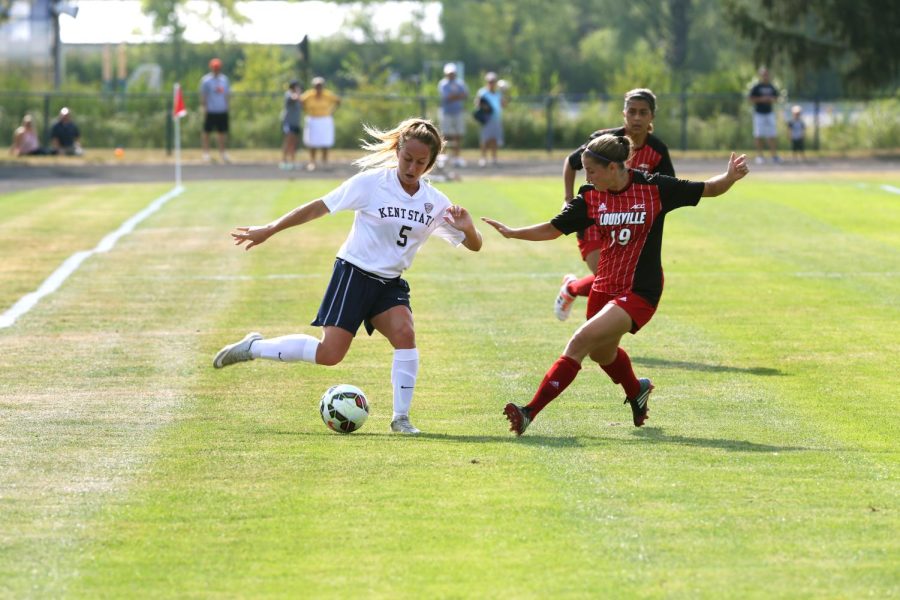 Sophomore forward Hayden Pascoe makes a pass during a game against The University of Louisville at Zoeller Field on Friday August 30, 2015. The Flashes ended the game in a 2-2 tie.