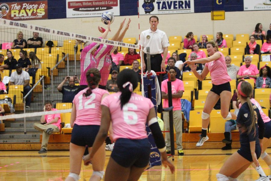 Opposite hitter Kelly Hutchison from the Flashes spikes the ball at the annual Dig for the Cure volleyball match vs. Northern Illinois at the MAC Center on Oct. 24, 2014.