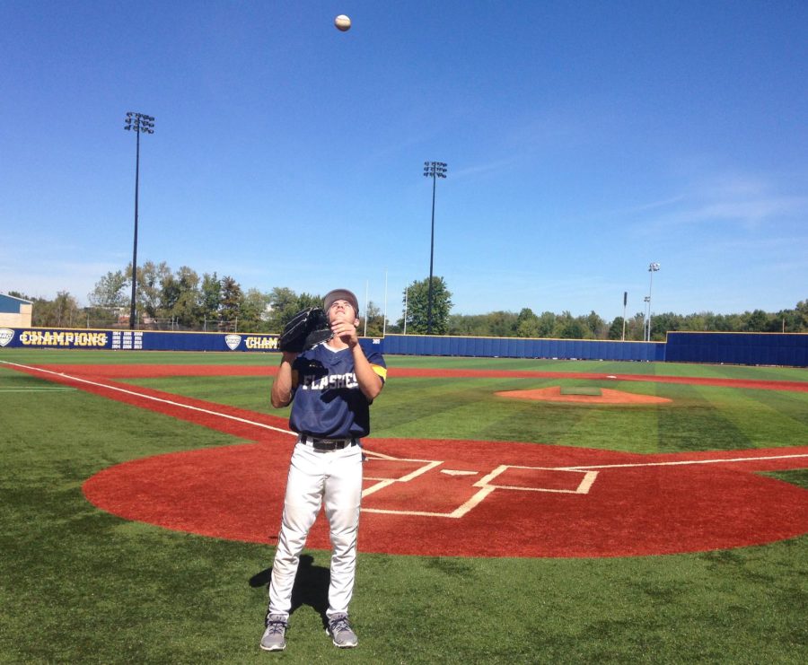 Kent State Mid-fielder Mason Mamarello tosses a ball to himself while waiting for practice to start. Mason started playing for Kent State after Akron University shut down its baseball program earlier this summer.