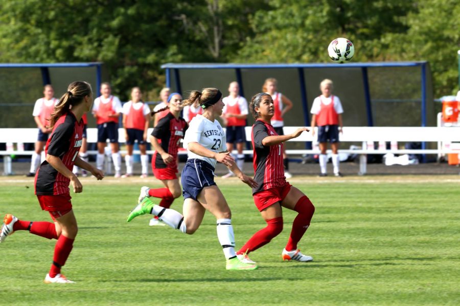 Junior Forward Jenna Hellstrom battles a player from the University of Louisville at Zoeller Field on Friday, August 28, 2015. The Flashes ended the game in a tie 2-2.