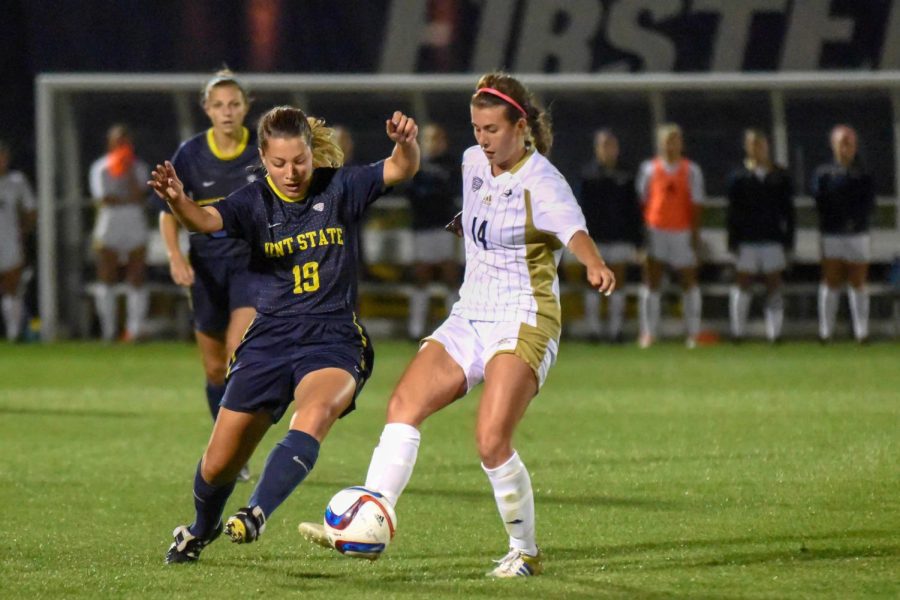 Briana Bartolone, senior, steals the ball away in the game against the Akron Zips at Cub Cadet Field on Friday Sept 25, 2015.