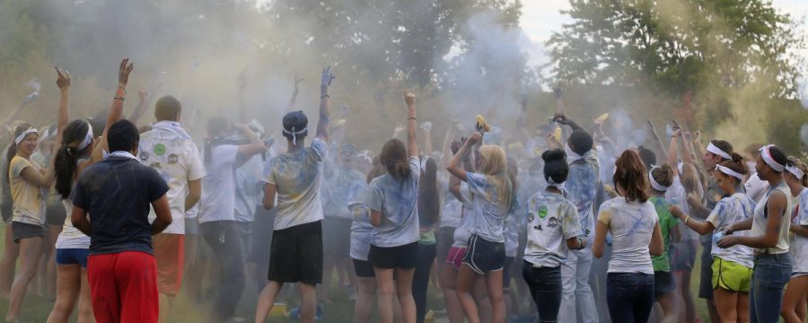 Students celebrate after the conclusion of the first Color War during Black Squirrel Fest on Friday Sept. 11, 2015.