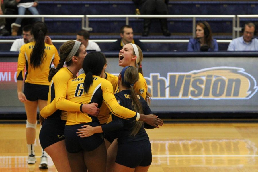 Kent State volleyball players cheer in a game against Miami in the M.A.C. Center on Friday, Nov. 14, 2014. 