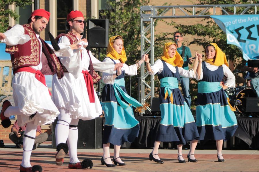 Nicole Cramer, freshman (middle) and Demi Tsangas, junior are are members of the Saint Constantine Helenic Dancers of Cleveland, that performed at Thursday’s Greek Fest, held in Risman Plaza, September 24.