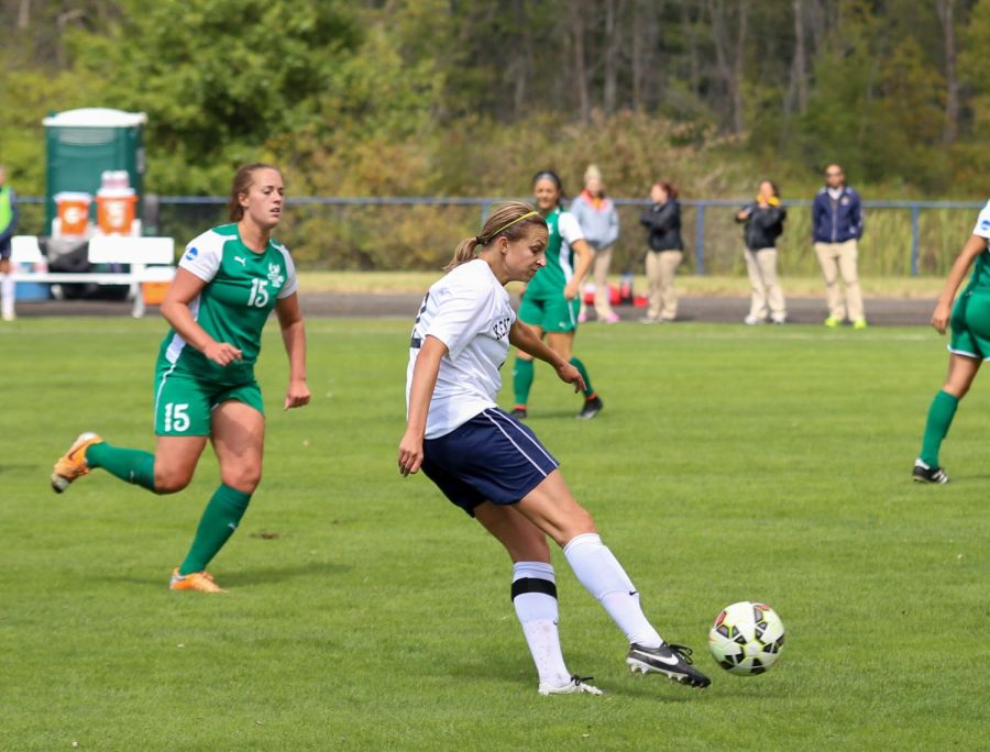 Junior Abbie Lawson kicks the ball from outside the box during a game against Cleveland State University on Sunday, Sept. 13, 2015.