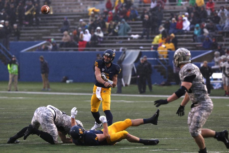 Sophomore Quarter Back Colin Reardon makes a play against Army at the Homecoming Game against Army. The Flashes went on to win their first game 39-17. October 17, 2014
