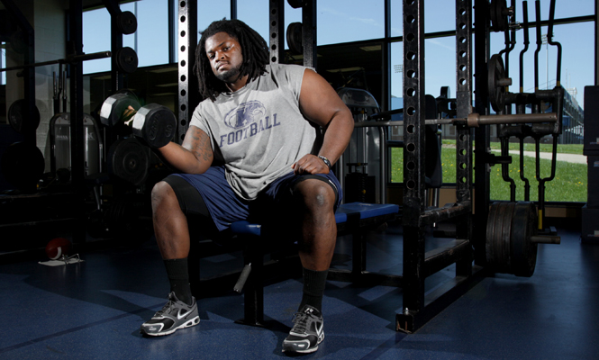 Senior defensive lineman Ishmaa’ily Kitchen works out in the fieldhouse on March 4. The Youngstown native is a top prospect for the NFL draft. Photo by Brian Smith.