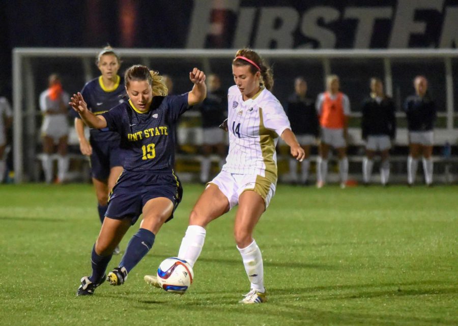 Briana Bartolone, senior, steals the ball away in the game against the Akron Zips at Cub Cadet Field on Friday, Sept. 25, 2015.
