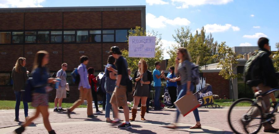 Student pass the College Democrats booth on the Esplande outside Bowman Hall on Tuesday Sept. 22, 2015.