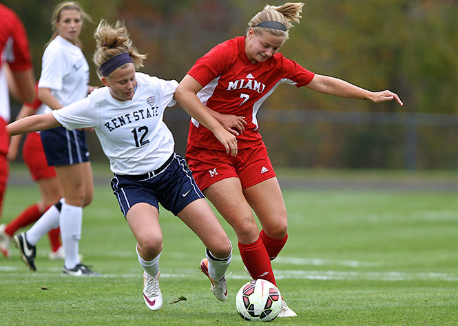 Kent State freshman center midfielder Kristen Brots attempts to gain possession of the ball at the game against Miami University on Friday, Oct. 10, 2014. The game ended in a draw, 1-1.