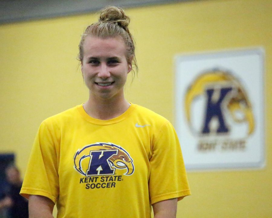 Junior forward, Jenna Hellstrom poses after stretching at practice at the Kent State Field House Wednesday, Oct. 28, 2015.