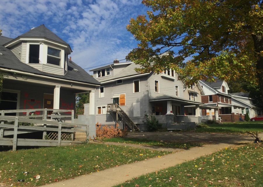 Houses on East College Avenue stand vacant with No Trespassing signs posted on front porches on October 12, 2015.