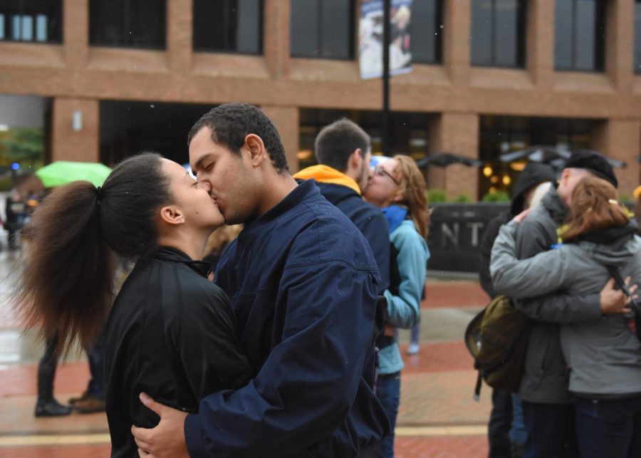 Electa Royal and Alex Vasquez, students at Kent State, kiss amidst other couples during Kiss on the K in Risman Plaza on October 3, 2015.