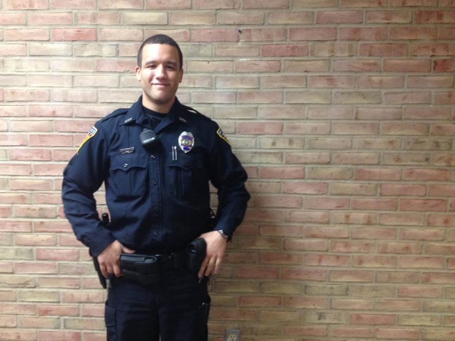 Officer Brandon Davis, of KSUPD, stands in Kent State’s University main campus library. Officer Davis became a police officer in the KSUPD in 2014 and this is the first year he will be patrolling Kent Halloween.