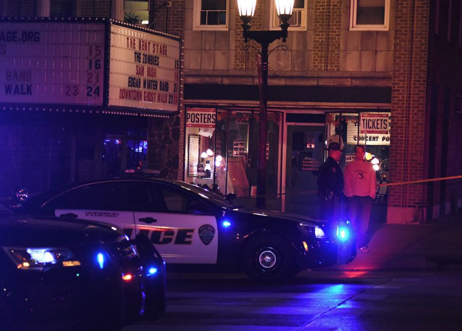 Kent Police officers, including Captain Jim Prusha (right) block traffic on East Main Street after a reported shooting at 2 a.m. on October 17 outside the Kent Stage.