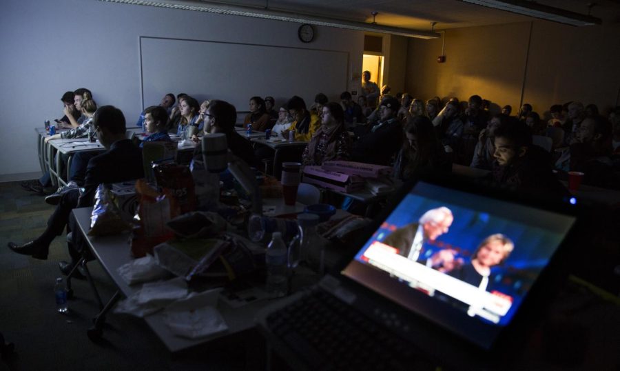 Students and members of the Kent State College Democrats watch the first Democratic Debate between Bernie Sanders, Hilary Clinton, Martin O’Malley, Jim Webb and Lincoln Chafee on a projector in Bowman Hall. Oct. 13, 2015.
