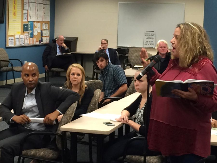 Mary Mural-Sizemore, whose son owns Porters Taxi, voices her concerns with Uber at the Kent City Council meeting on Wednesday, Oct. 7, 2015. Delon White, Ubers general manager of Northeast Ohio, sits on the left.