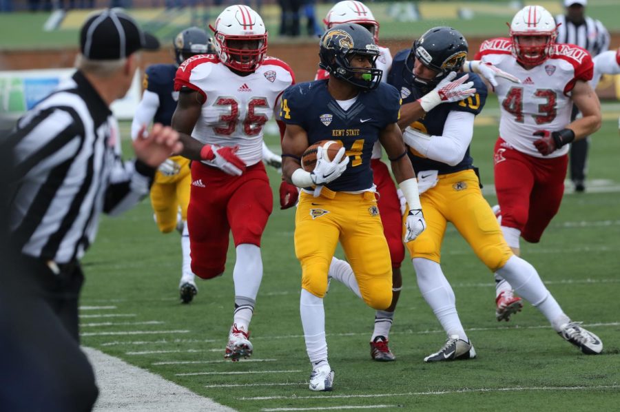 Freshman running back Raekwon James dodges Miami defensive players during the Kent State Homecoming game at Dix Stadium. The Flashes defeated the Red Hawks 20-14. October 3, 2015.