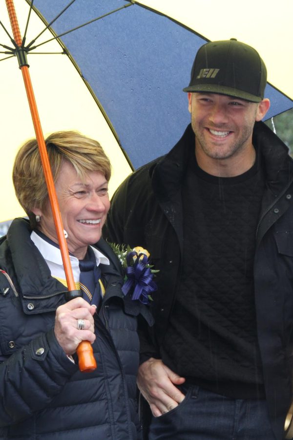 Kent State University President Beverly Warren and Kent State alumnus and current New England Patriots player Julian Edelman get ready to start the Kent State Homecoming Parade on Saturday, Oct. 3, 2015. Edelman returned to his alma mater to take part in the Homecoming parade as Grand Marshal. 