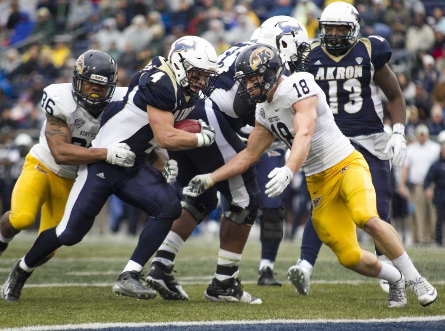 Senior running back Connor Hundley scores the touchdown for the Akron Zips during the first quarter of the Battle for the Wagon Wheel on Nov. 27, 2015 at InfoCision Stadium. Kent State lost to Akron 20-0.