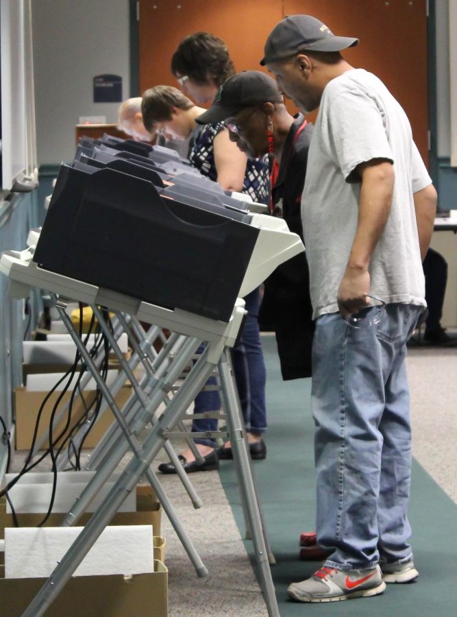 Voters fill the poll booths at the Wellness Center on Tuesday Nov. 3, 2015.
