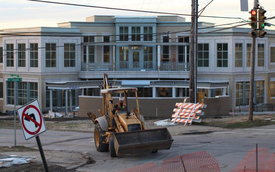 A member of the Area Wide Protective Street construction company drives a bulldozer up Summit Street in front of the Institutional Advancement Building on Monday, Nov. 9, 2015.