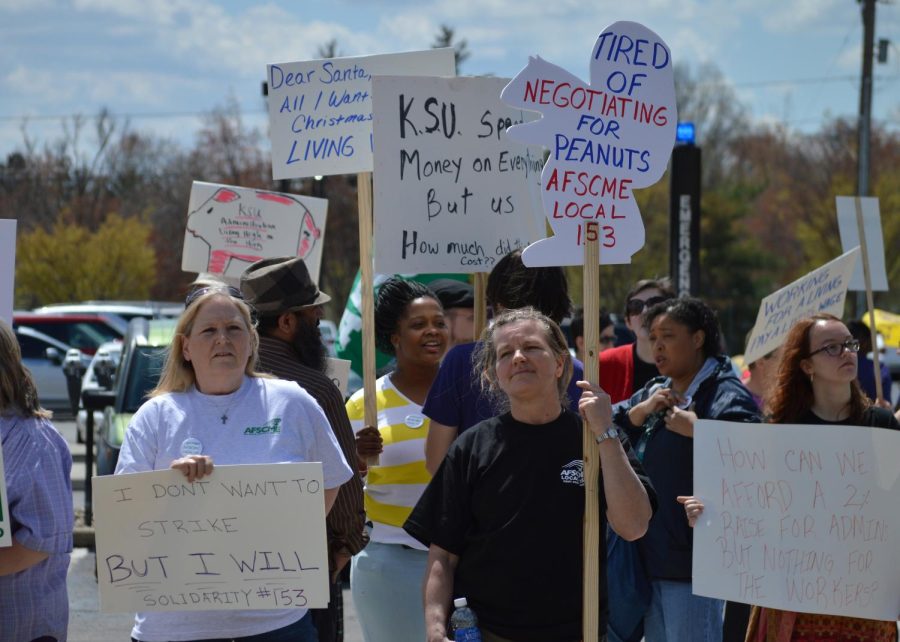 Members of AFSCME, a workers union on campus, and USAS, a student group supporting the union, picket outside the M.A.C. Center on May 1, 2015 as President Beverly Warren is inaugurated inside.