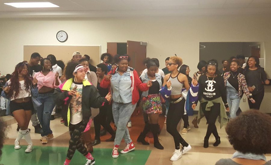 Students line-dance at BUSs 90s vs. 2000s community dinner in the Oscar Ritchie Multipurpose Room on Monday, Nov. 9, 2015.