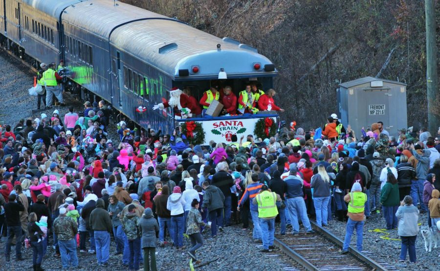 A crowd gathers around the CSX Santa Train in Fremont, Kentucky. The train takes 14 stops through Kentucky, Virginia and Tennessee. Nov. 21, 2015. 
