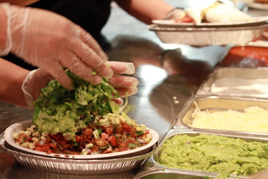 Photo Courtesy of TNS: The final touches are added to a Burrito Bowl at a Chipotle restaurant in Chicago, Illinois, on September 28, 2011. (Michael Tercha/Chicago Tribune/MCT)