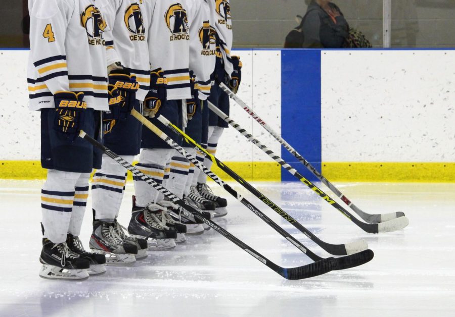 The starting line for the Kent State hockey team stands across the blue line while the national anthem is played before their against the University of Pittsburgh Friday, Nov. 6, 2015.