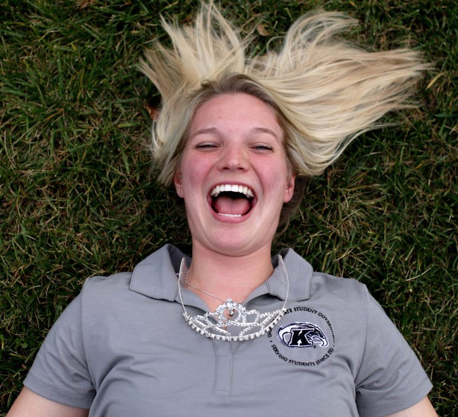 USG Senator and homecoming queen, Amanda Bevington, lays in the grass outside of the Student Center on Tuesday, Oct. 27, 2015. Amanda wore her USG shirt and brought her homecoming crown.