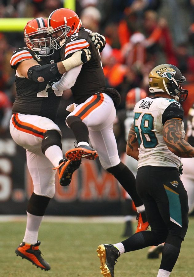Cleveland quarterback Brandon Weeden, right, celebrates with offensive lineman Joe Thomas after he completed a 95-yard touchdown pass in the fourth quarter to Josh Gordon against Jacksonville at FirstEnergy Stadium on Sunday, Dec. 1, 2013, in Cleveland, Ohio. The Jaguars defeated the Browns, 32-28. (Ed Suba Jr./Akron Beacon Journal/MCT)