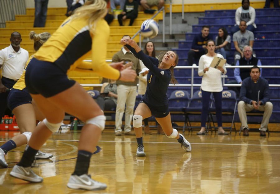 Challen Geraghty, sophomore defensive specialist, sets the ball during a game against Eastern Michigan University on Saturday, Nov. 7, 2015. The Flashes beat Eastern Michigan 3-1.