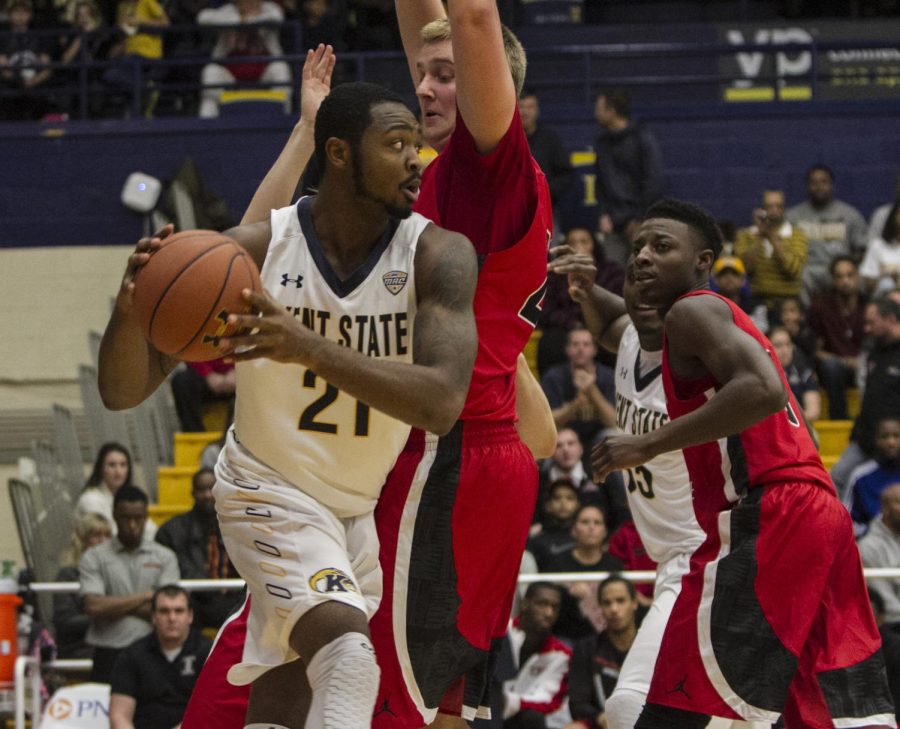 Senior center Kahliq Spicer looks to pass the ball after gathering the offensive rebound during the first half of the Kent State vs Youngstown game on Nov. 14, 2015. The Golden Flashes won 79-70.