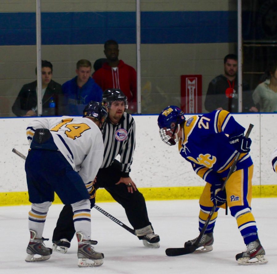 Forward Jon Buttitta faces off against a University of Pittsburgh player on Friday, Nov. 7, 2015.