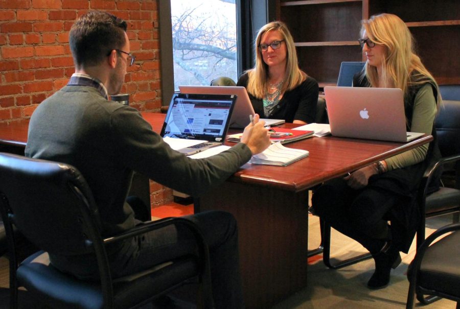 (from left to right) PhD student in Health Policy and Management Matthew Nichols, master student with concentrations in Public Health and Environment Health Naomi Carlson and PhD student in Health Policy and Management Carissa Smock, study in Lowry Hall on Monday, Dec. 7, 2015. The Council on Education for Public Health accredited Kent State's College of Public Health.
