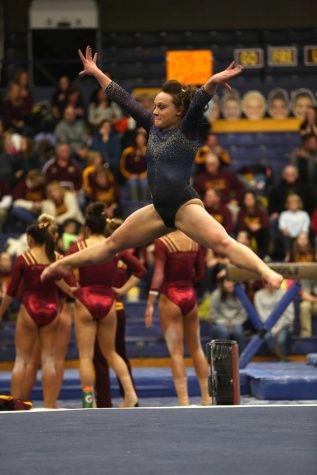 Current junior Skyelee Lamano during her floor routine at a home meet against Central Michigan State. The Flashes lost the meet 195.325 to 196.400. Feb. 15, 2015.