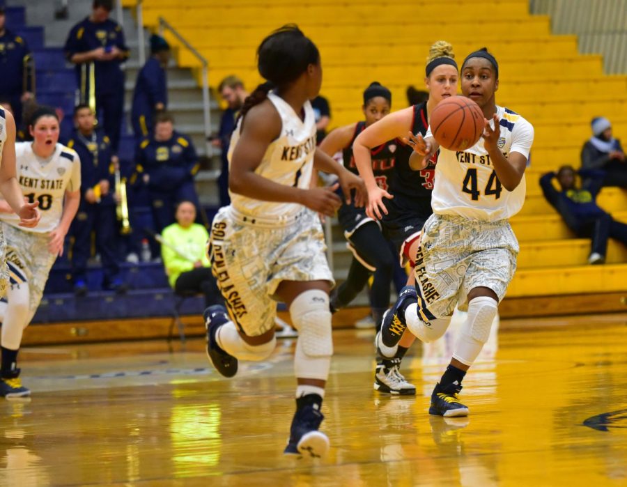 Freshman guard Tyra James passes the ball to sophomore guard Naddiyah Cross in a game against Northern Illinios on Wednesday, Jan. 27, 2016. The Flashes won 95-85.