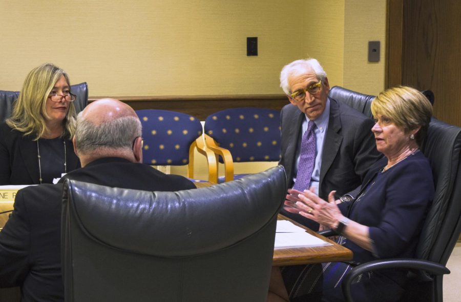 From left: Charlene Reed, Stephen Colecchi and Lawrence Pollock of the Board of Trustees meet with President Beverley Warren on Jan. 20, 2016. The board ratified the new collective bargaining agreement for tenured and tenure-track professors.